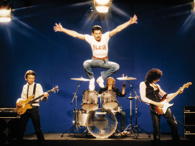 Queen band performing on stage