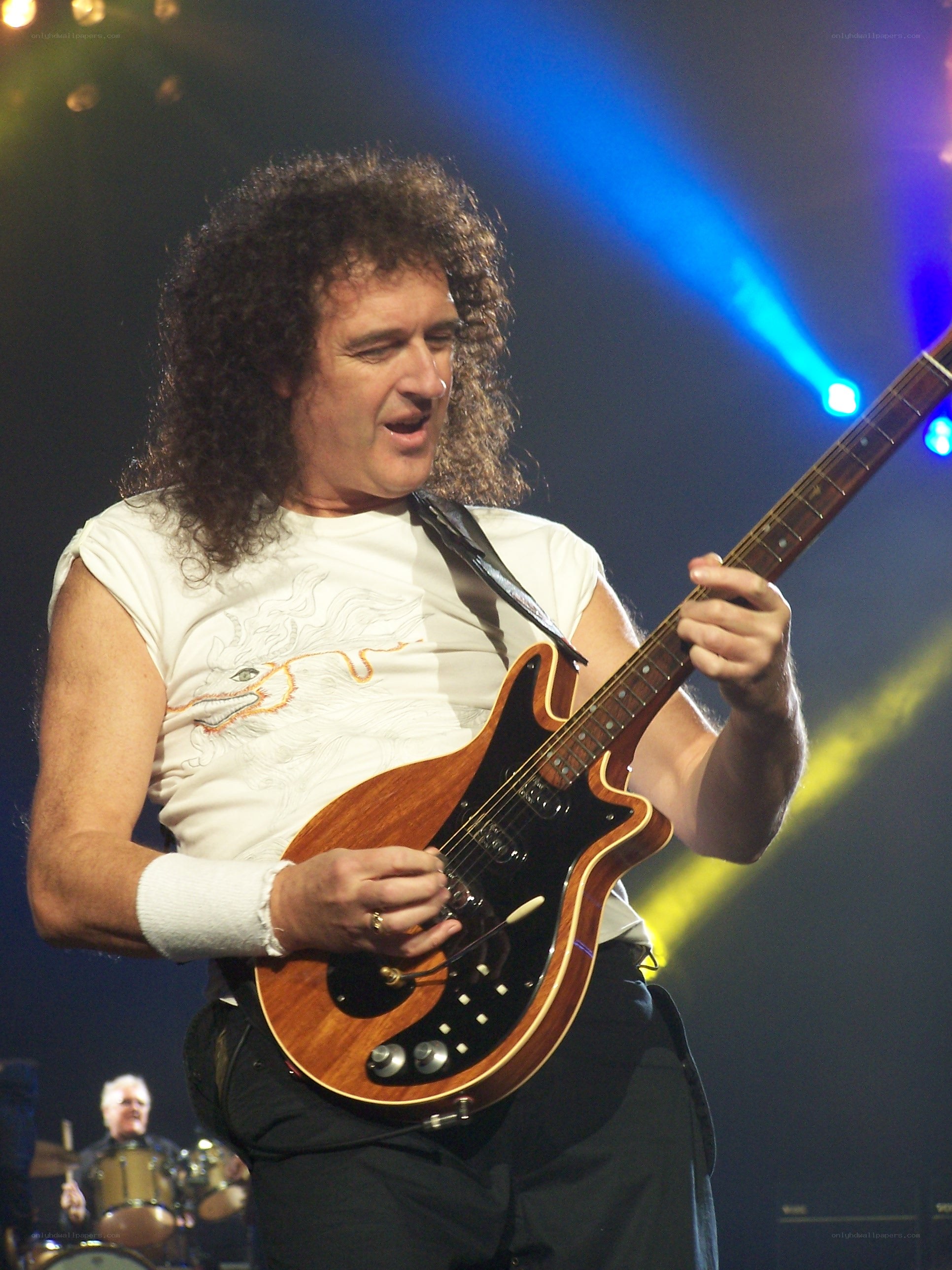 Queen guitarist performing on stage