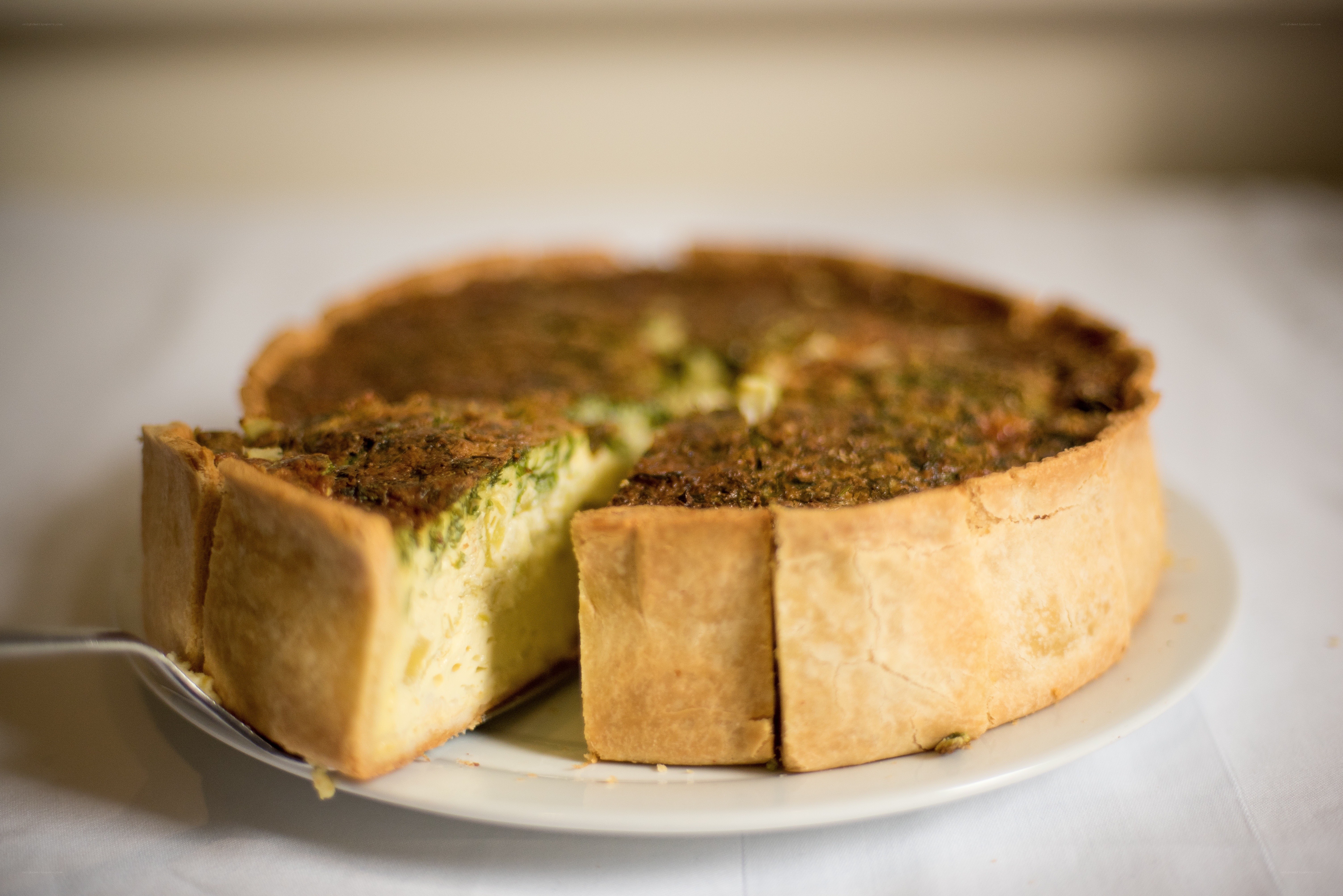 Quiche with a slice removed