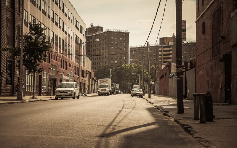Quiet city street with parked cars