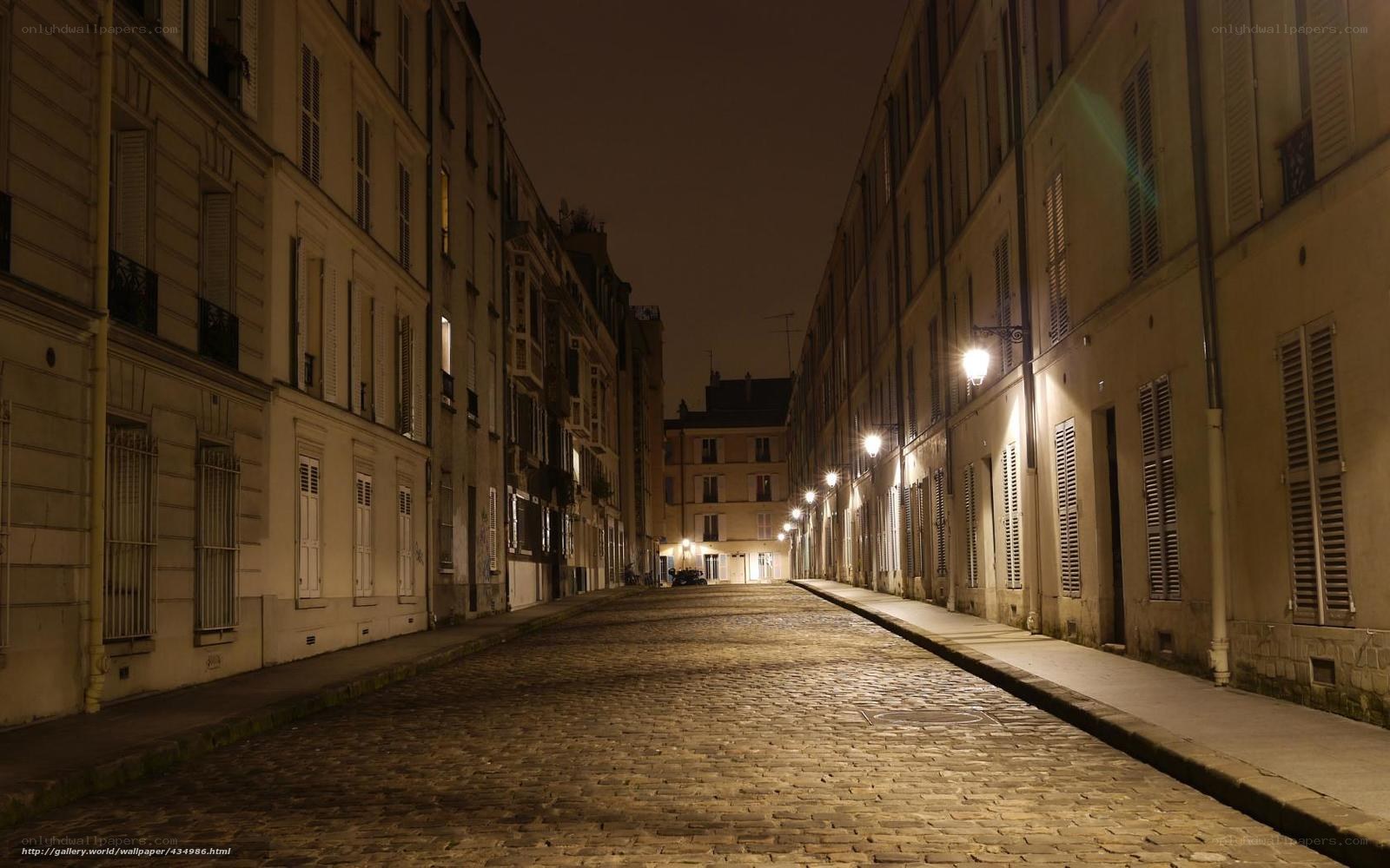 Quiet cobblestone street at night