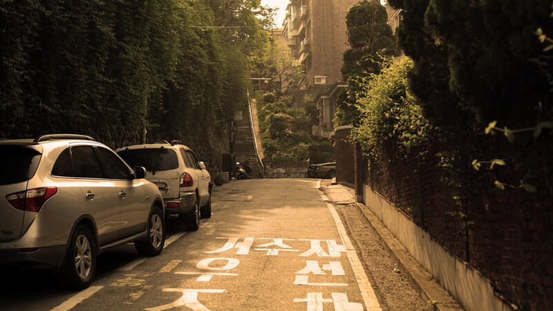 Quiet street with parked cars