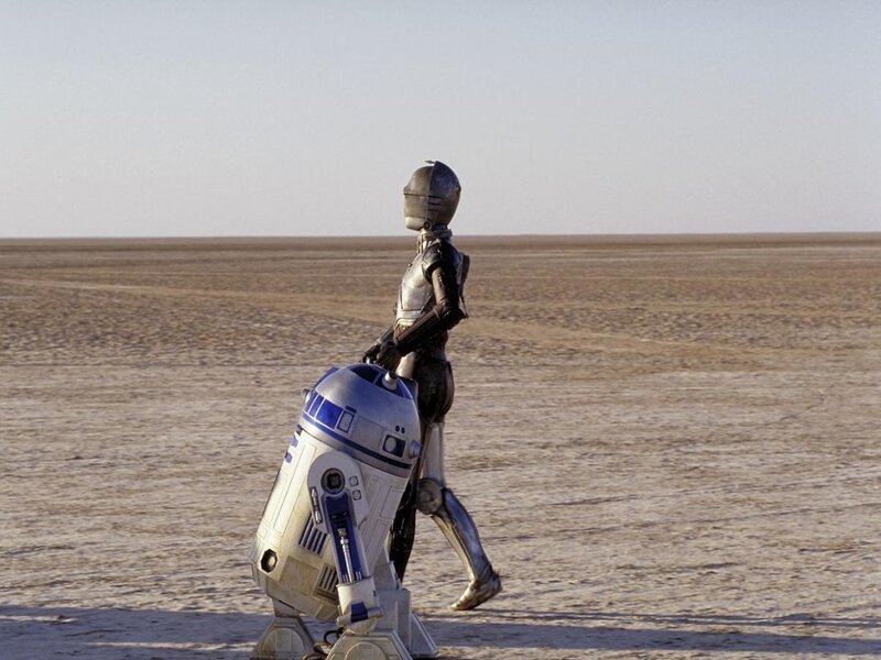 R2-D2 and C-3PO on a desert planet