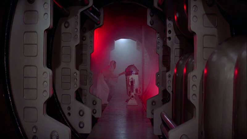 R2-D2 and Figure in Corridor