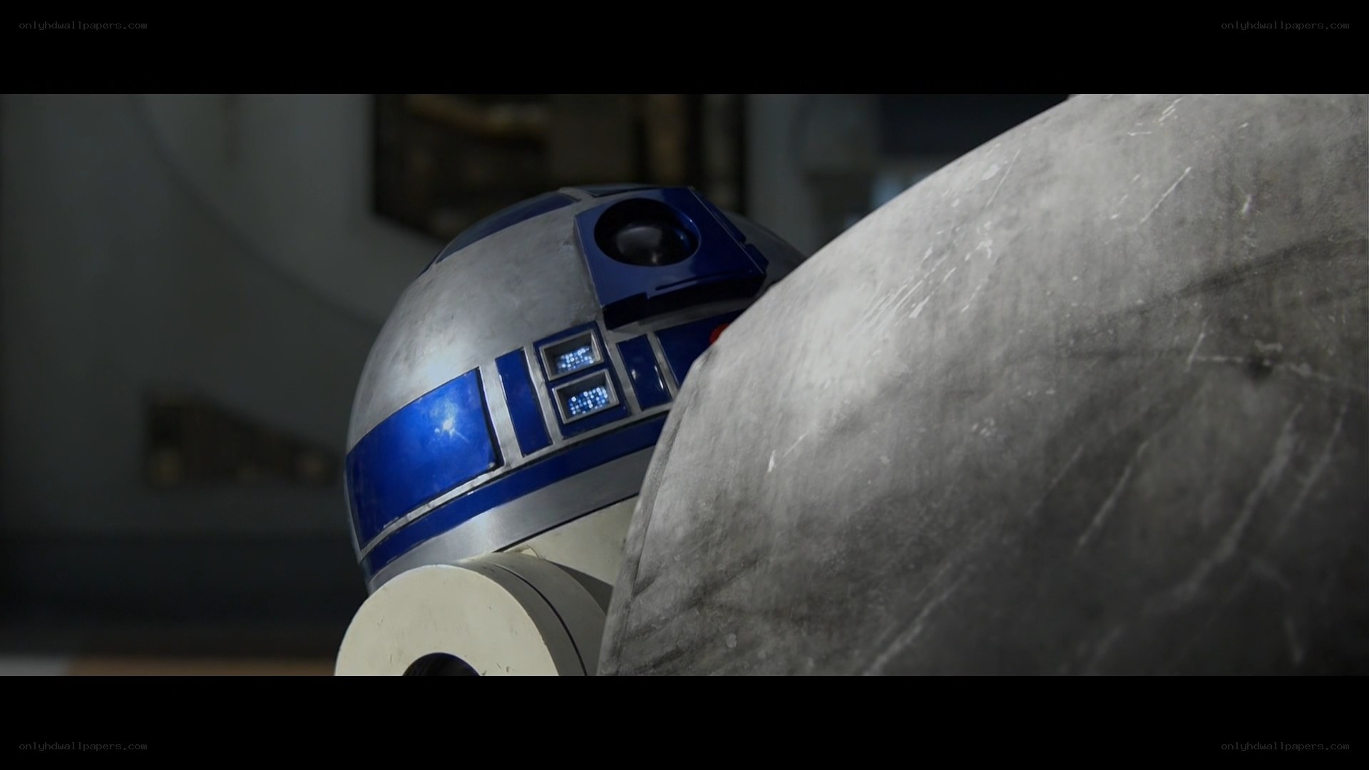 R2-D2 in a dimly lit room