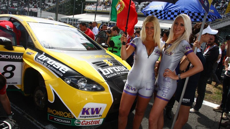 Race car and grid girls at event