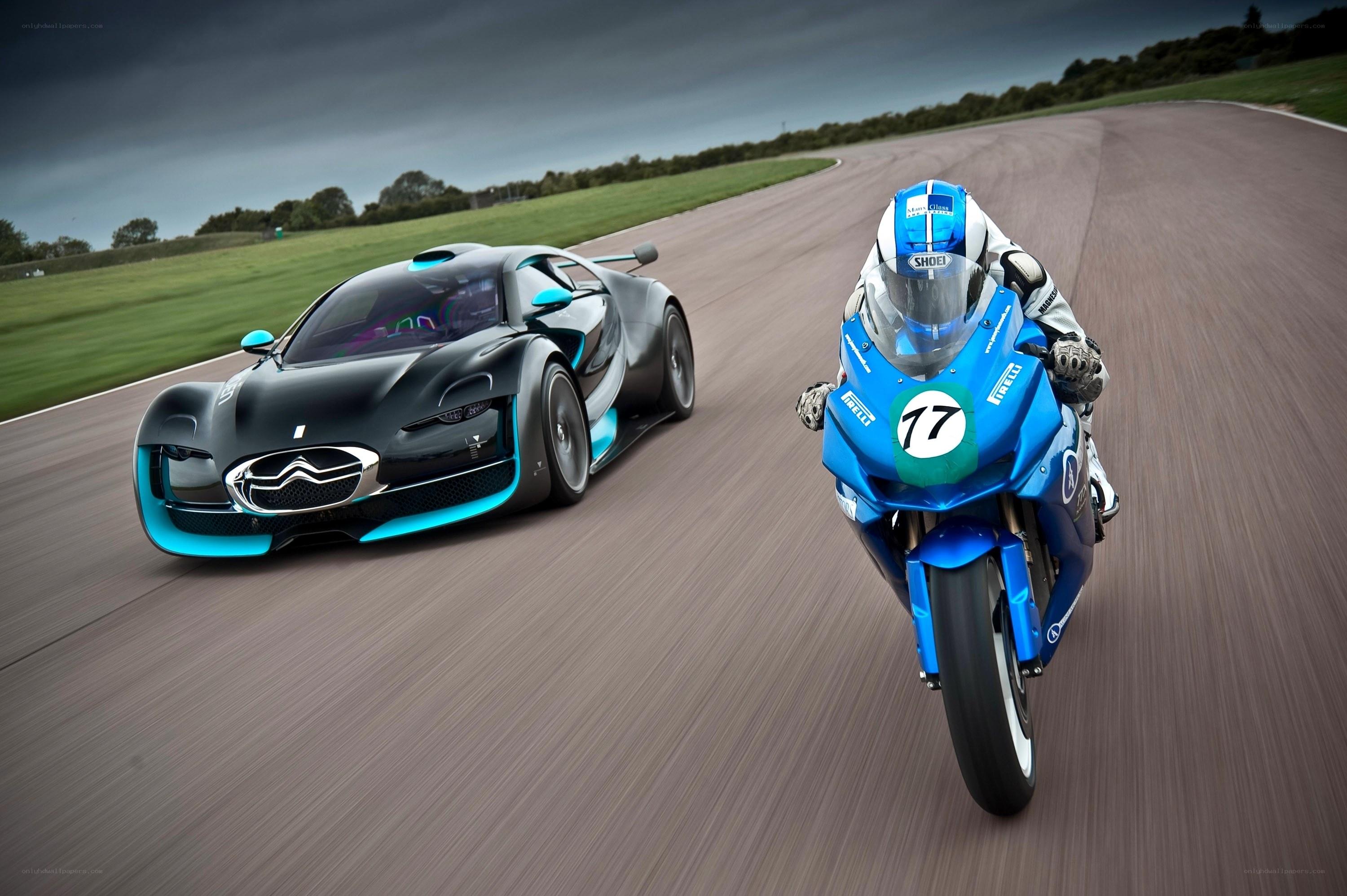 Race car and motorcycle on track