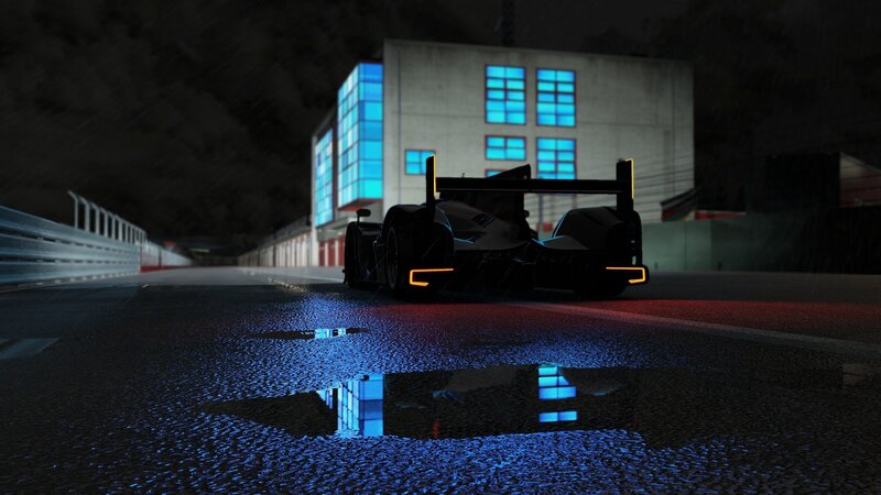 Race car at night on wet track