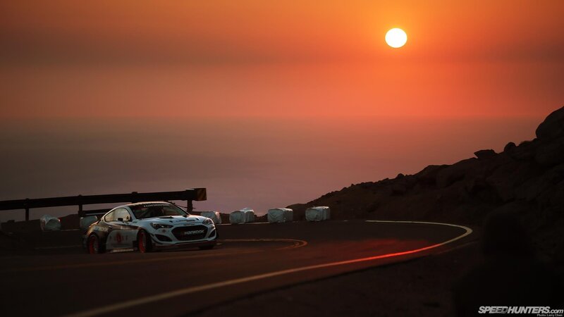 Race car at sunset on winding road