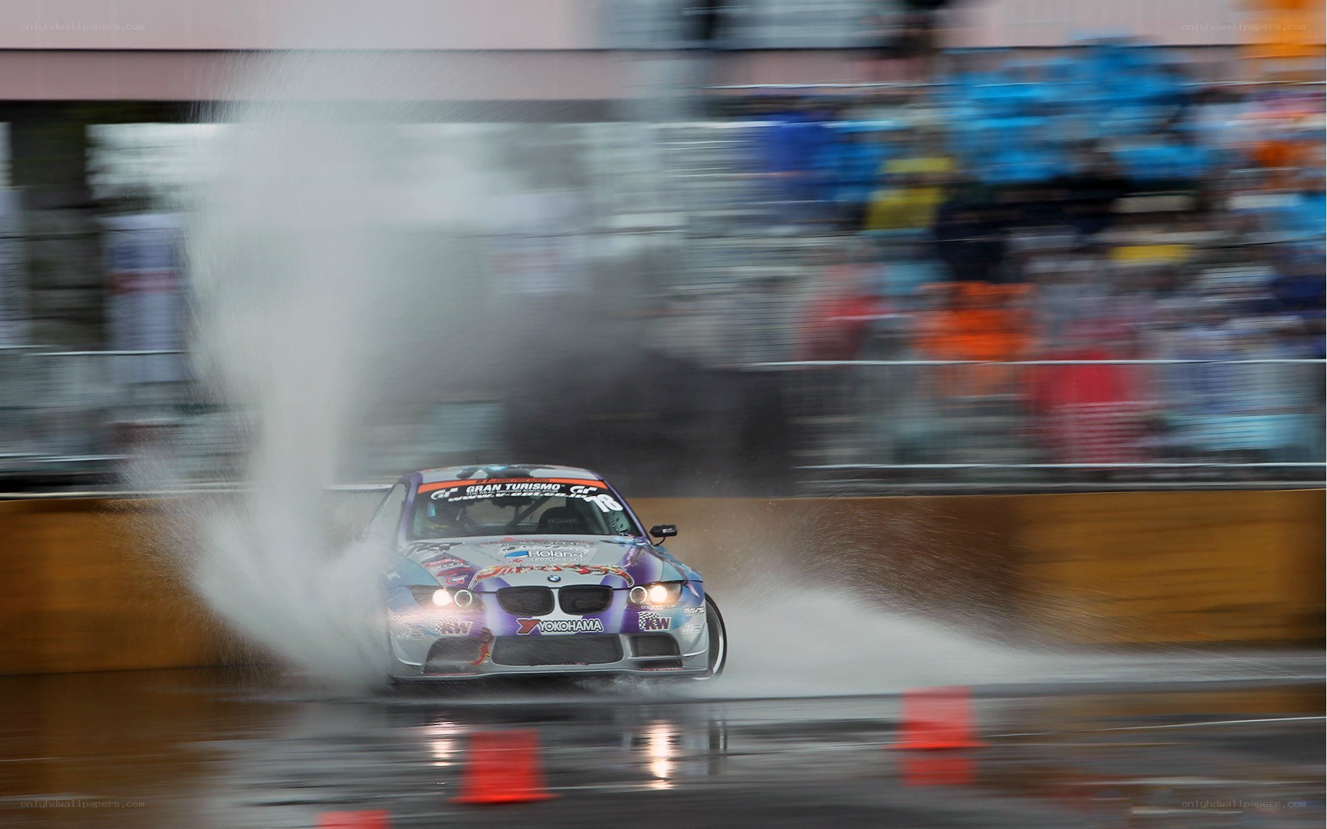 Race car drifting in rain