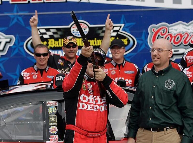 Race car driver celebrates victory
