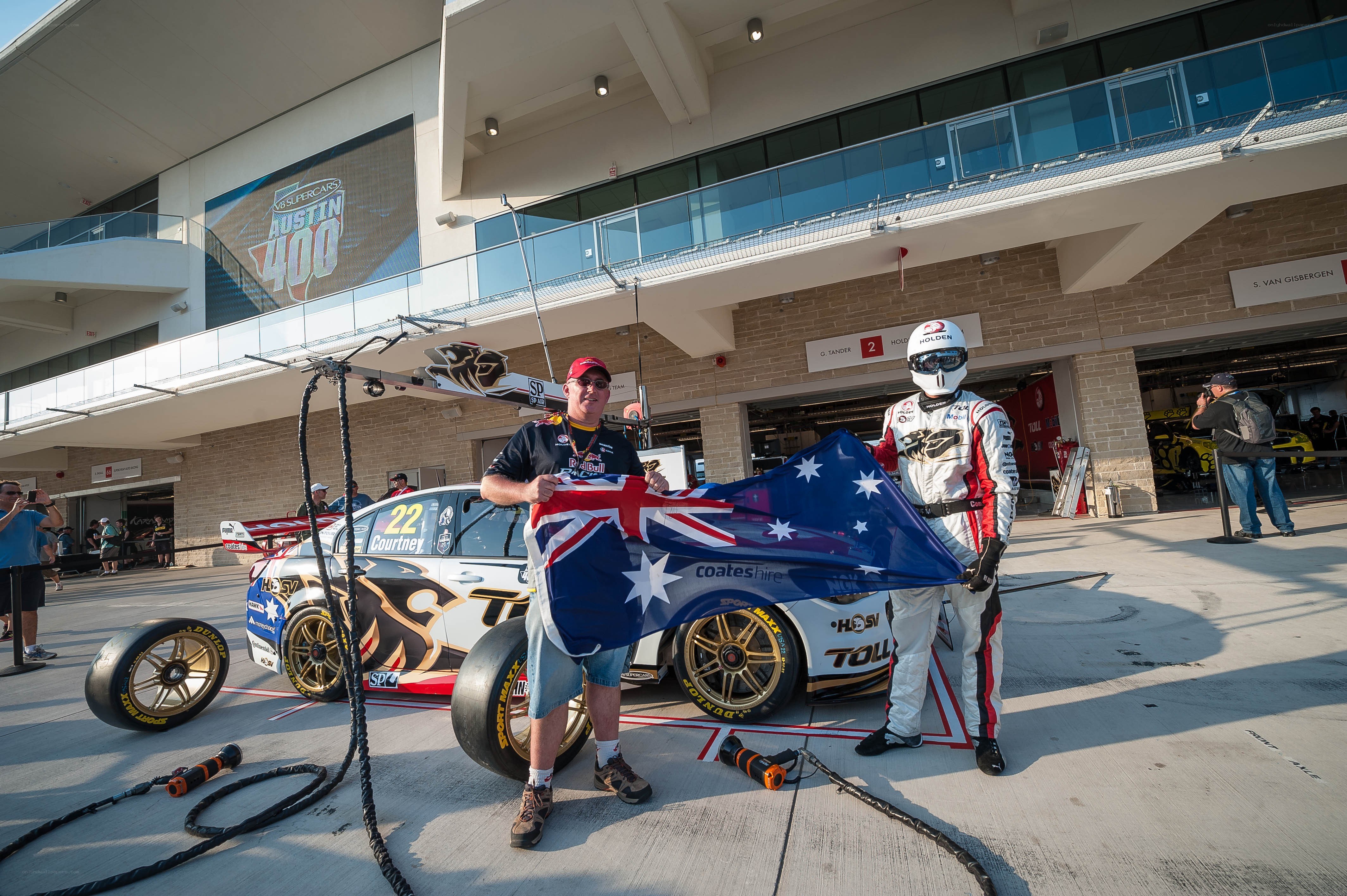 Race car driver with fan and flag