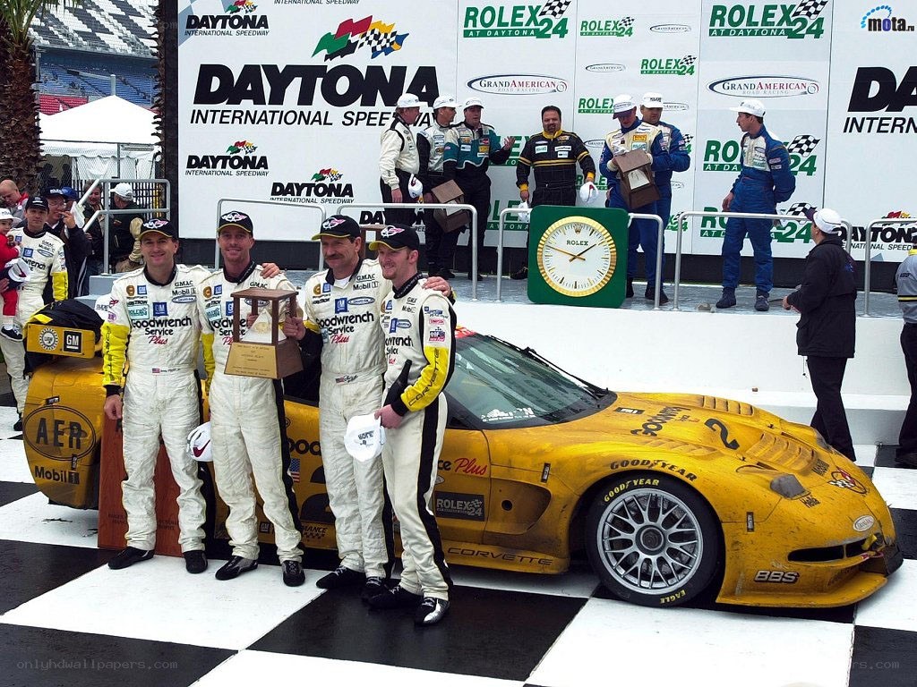 Race car drivers on podium