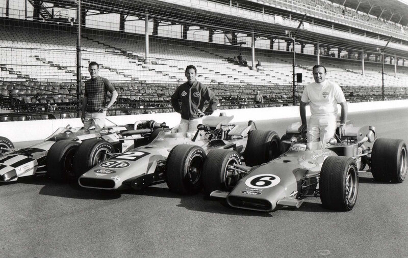 Race car drivers with their cars