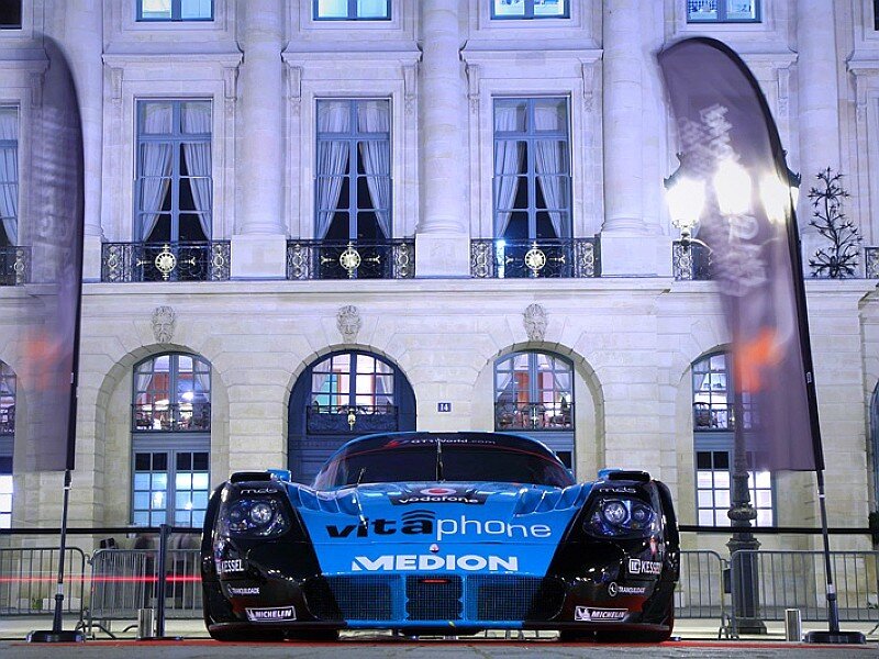 race car in front of building