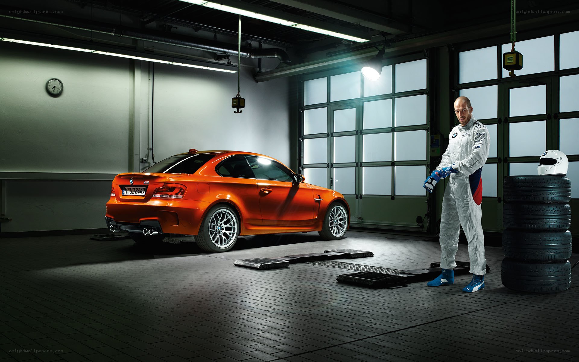 Race car in garage with driver