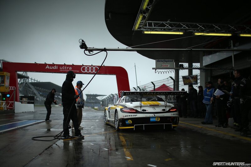 Race Car in Pit Lane — Black, Dramatic, Morning