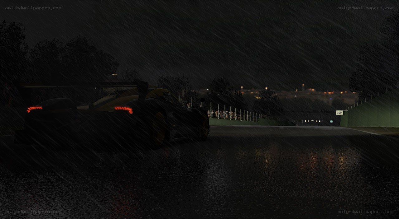 Race car in rain at night