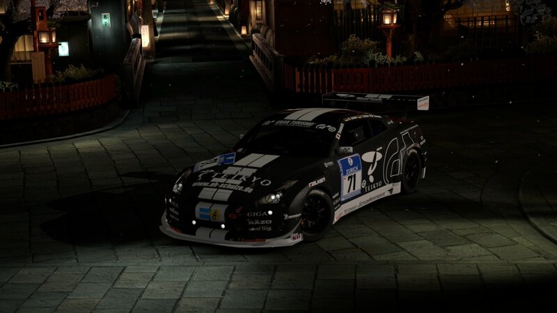race car on a street at night