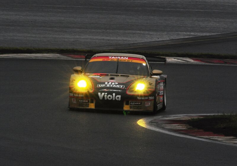 Race car on a track at night
