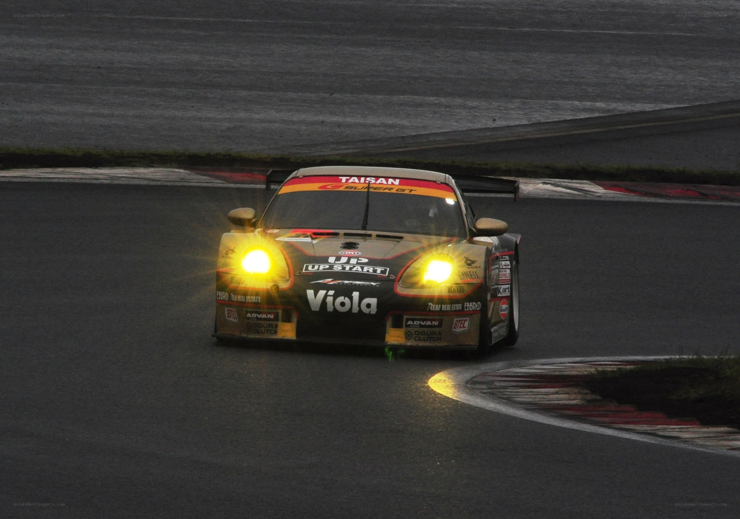 Race car on a track at night