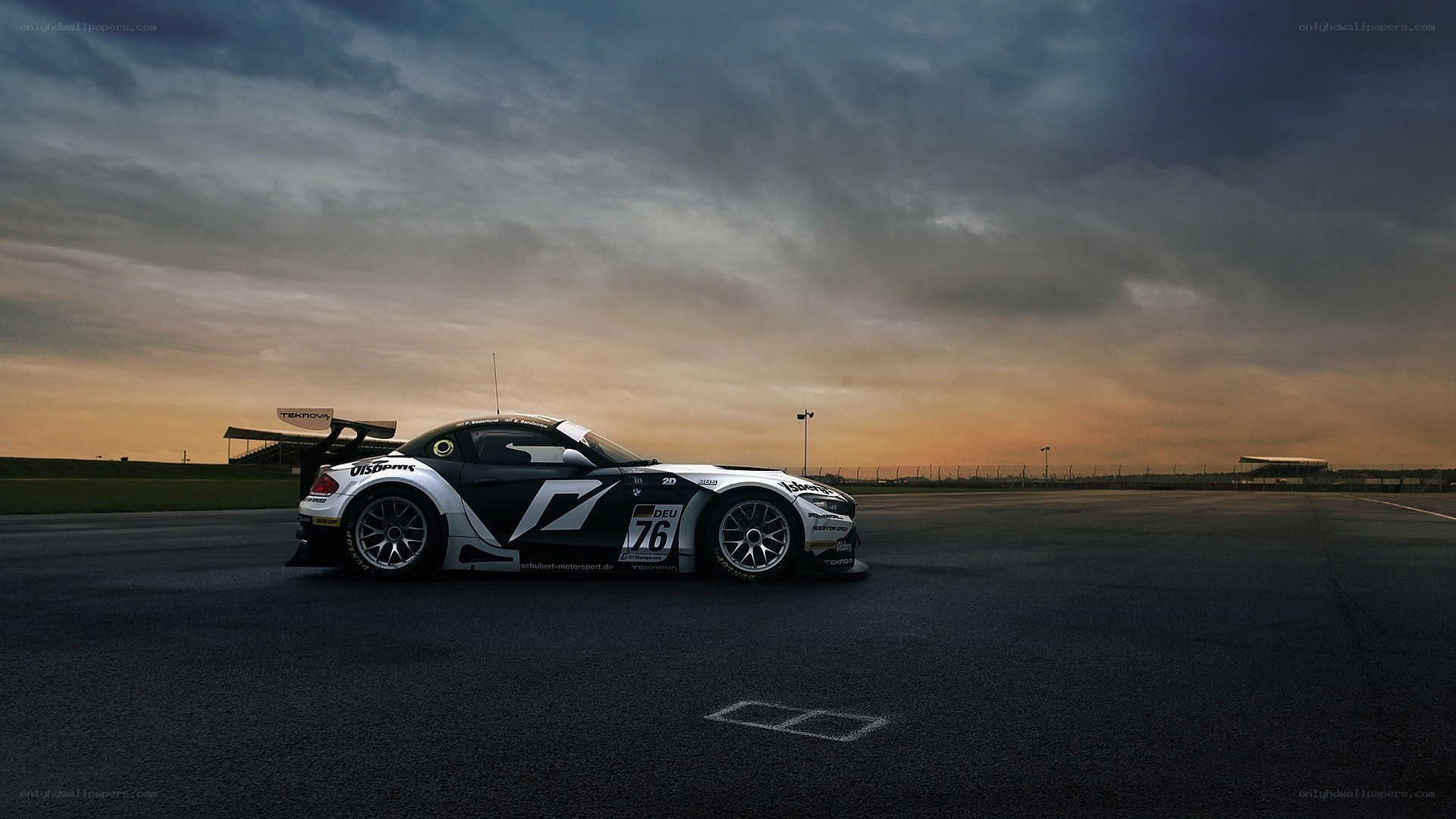 Race car on a track at sunset