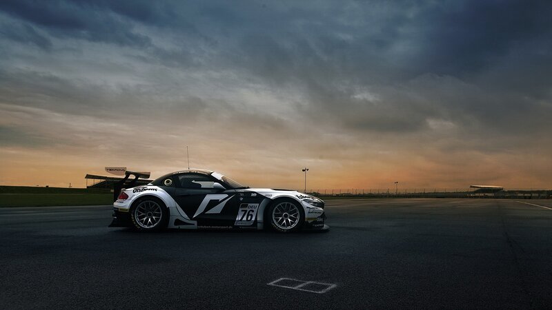 Race car on a track at sunset