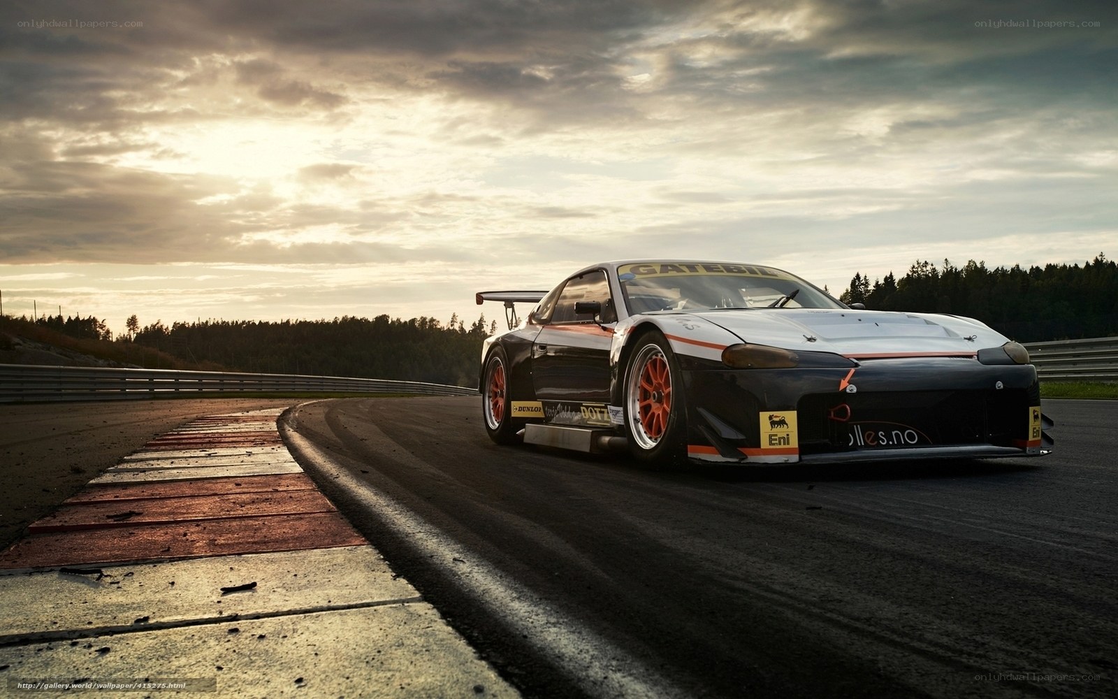 Race car on a track at sunset