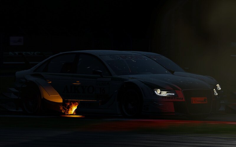 Race car on fire at night