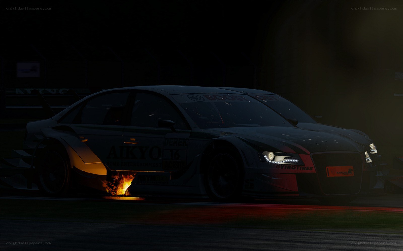 Race car on fire at night