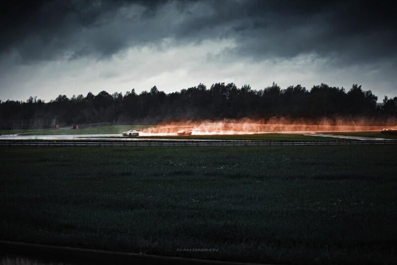 Race car on fire at night