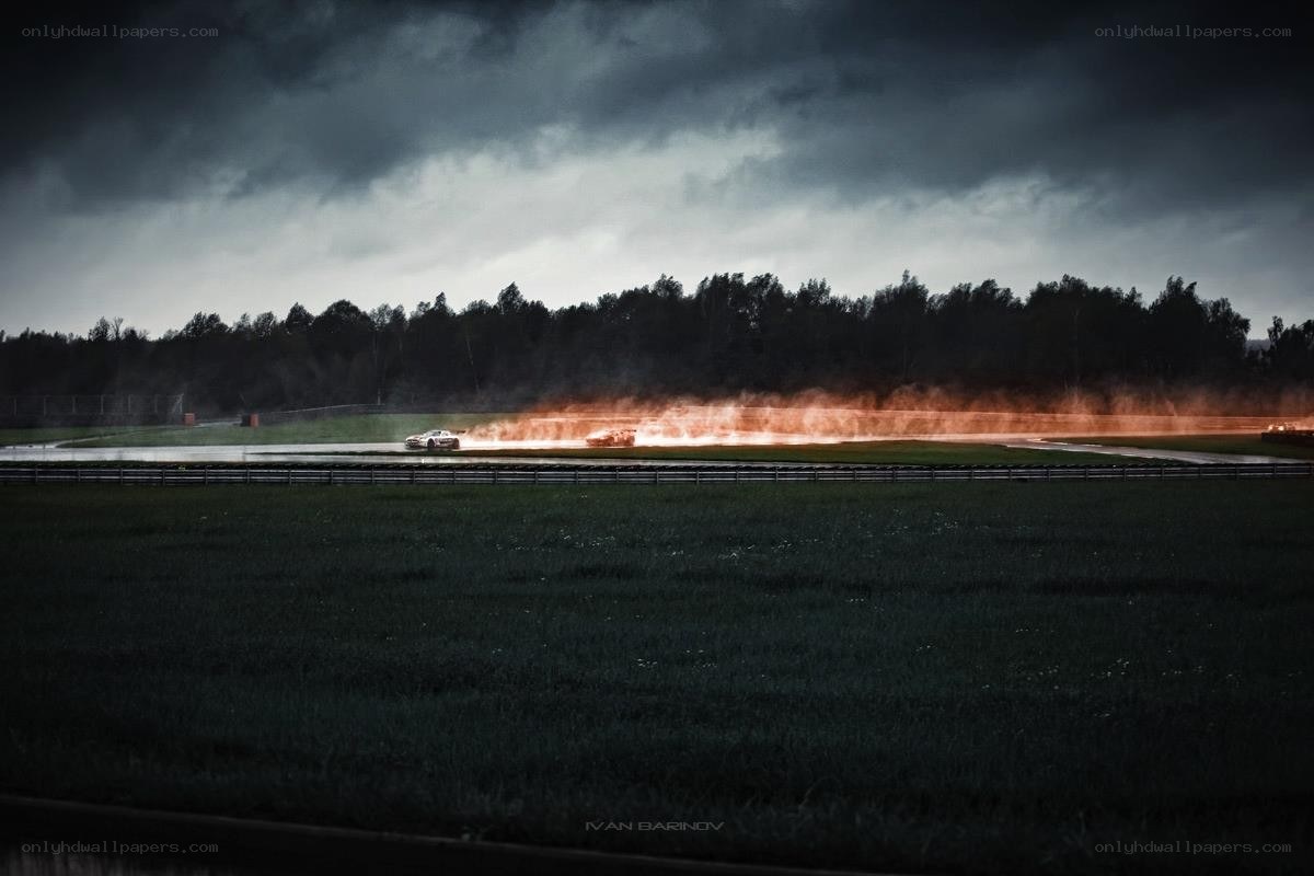 Race car on fire at night