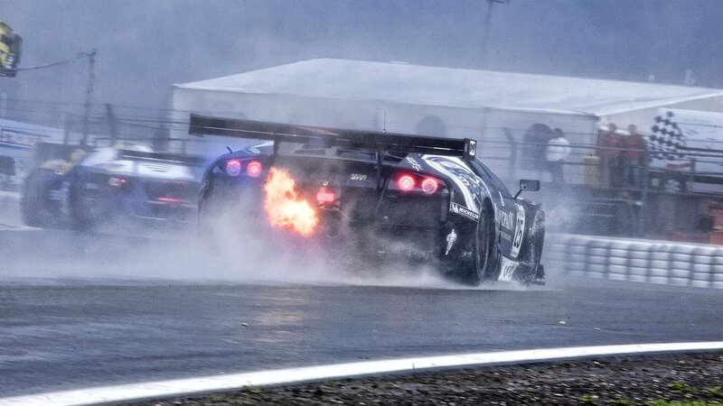 Race car on fire during wet race