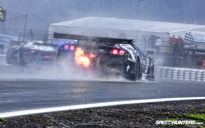 Race car on fire during wet race