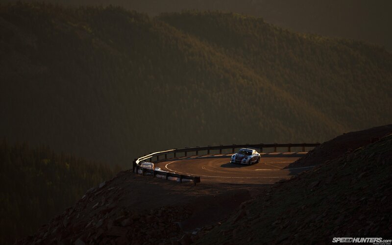 Race Car on Mountain Road — Brown, Dramatic