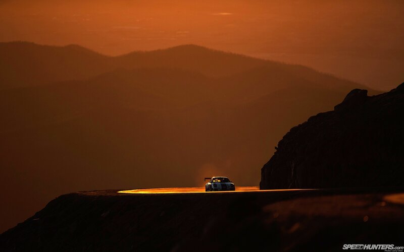 Race Car on Mountain Road — Orange, Dramatic