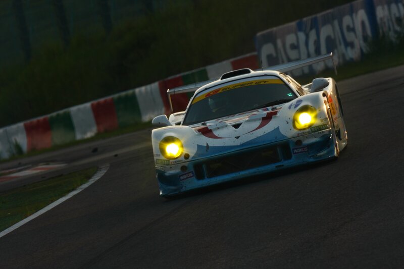 race car on track at dusk
