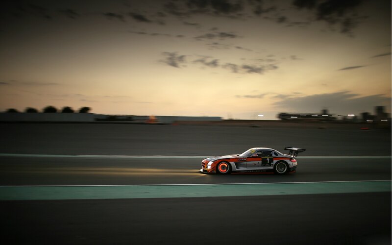 Race car on track at dusk