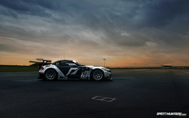 race car on track at dusk