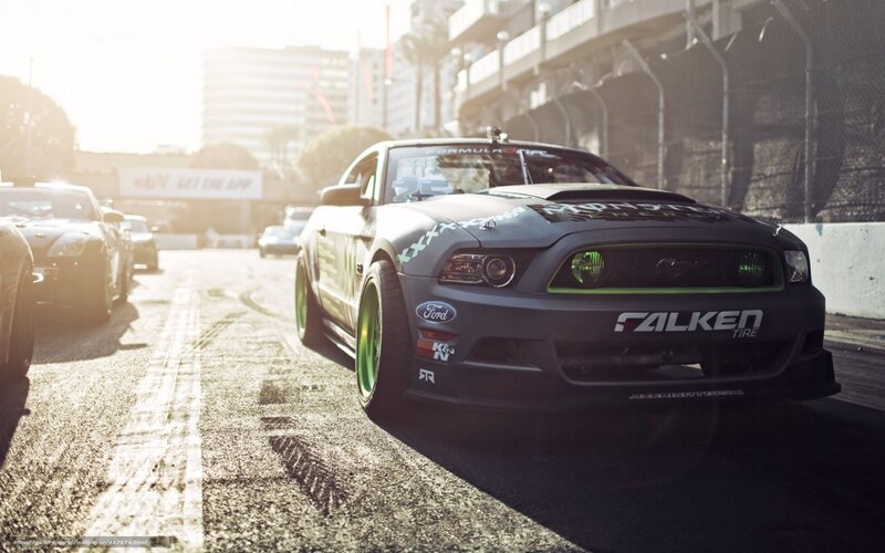 race car on track at sunrise