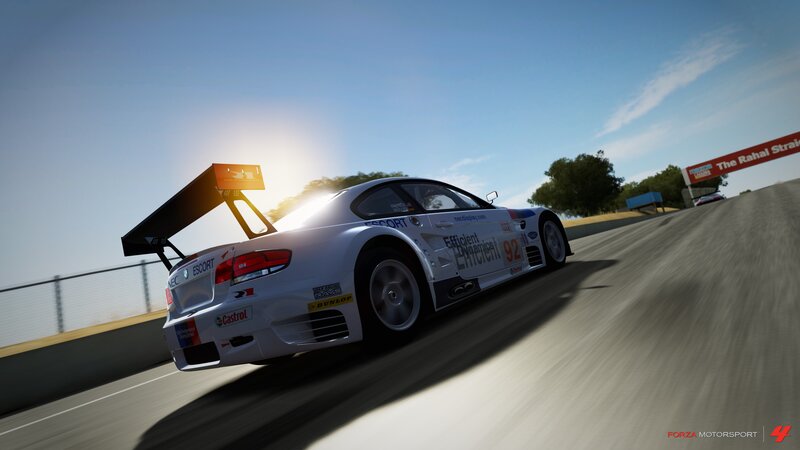 race car on track at sunset