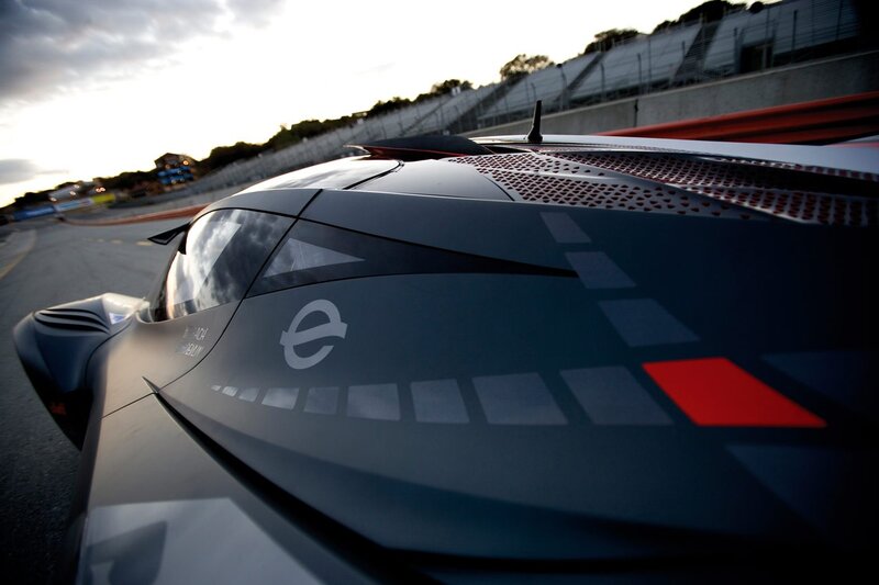 race car on track at sunset