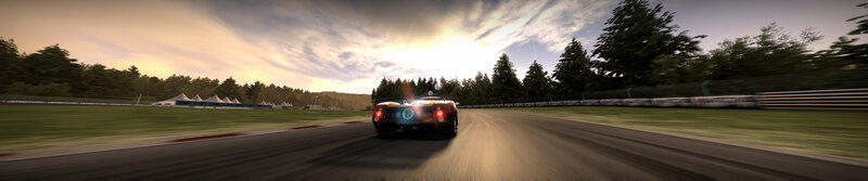 race car on track at sunset