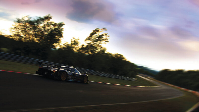 race car on track at sunset
