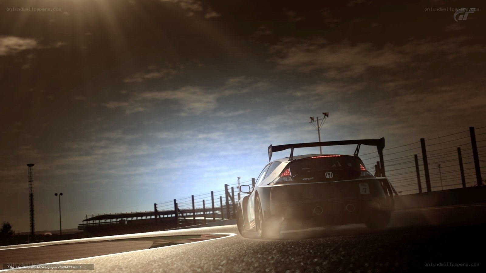 race car on track at sunset