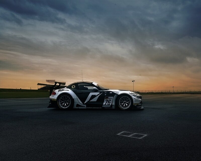 Race Car on Track — Black, Dramatic, Sunset, Photograph, Sky, Clouds