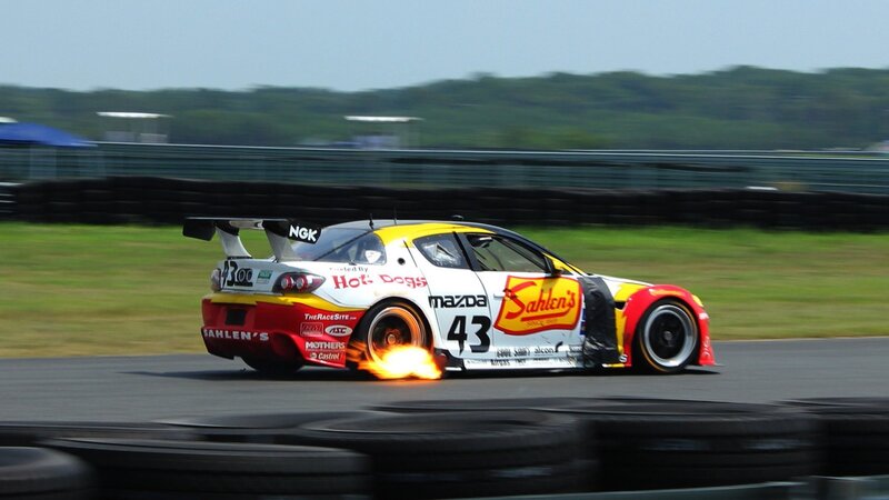Race Car on Track — White, Dynamic, Afternoon, Photograph, Fire, Tire Barrier