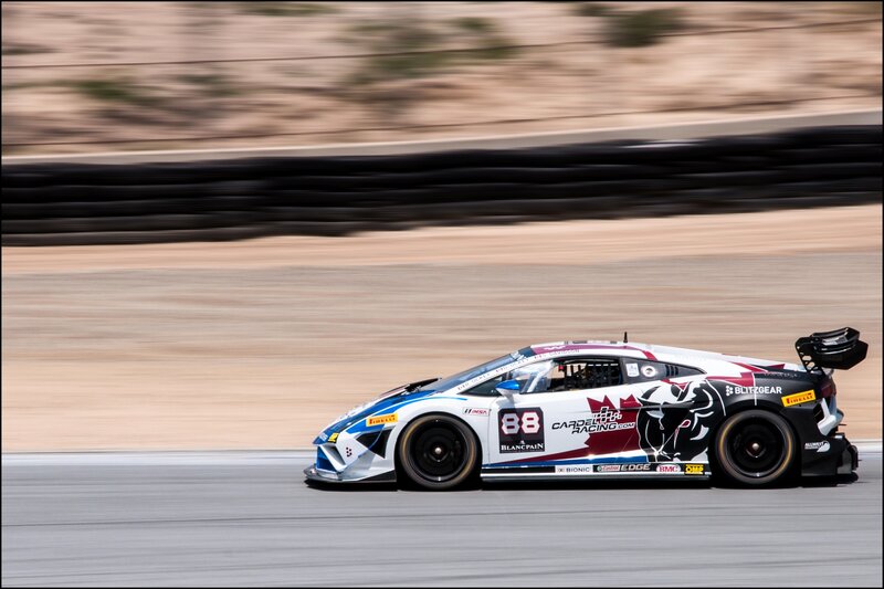 Race Car on Track — White, Dynamic, Afternoon, Photograph, Tire Barrier