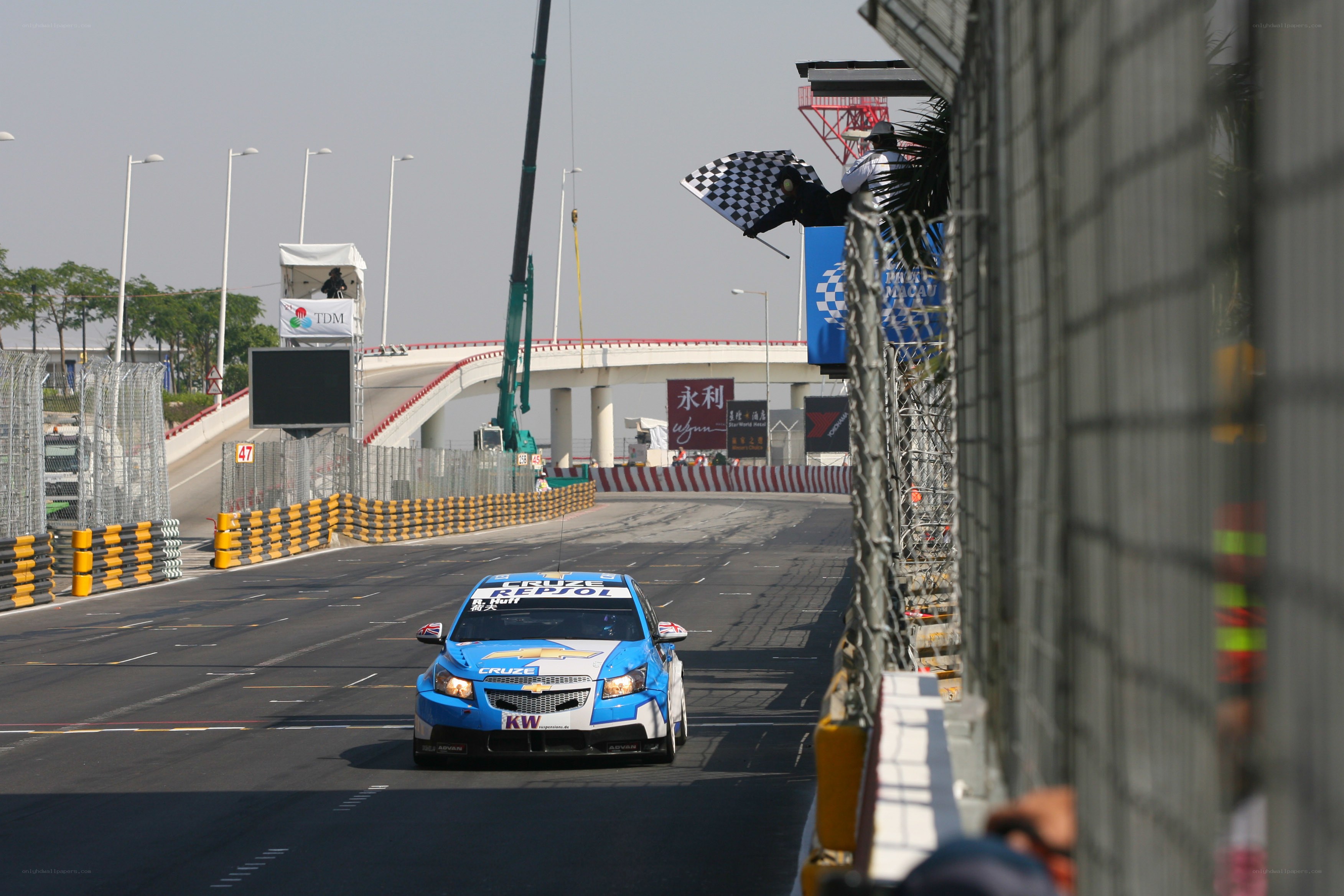 Race car on track with checkered flag