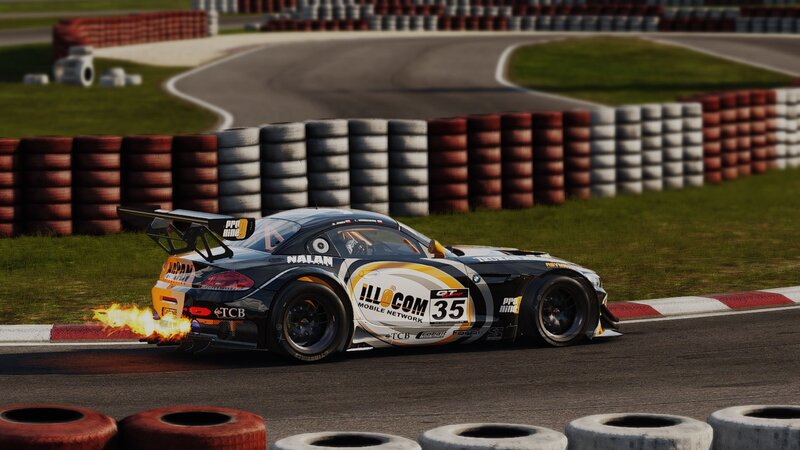 race car on track with flames